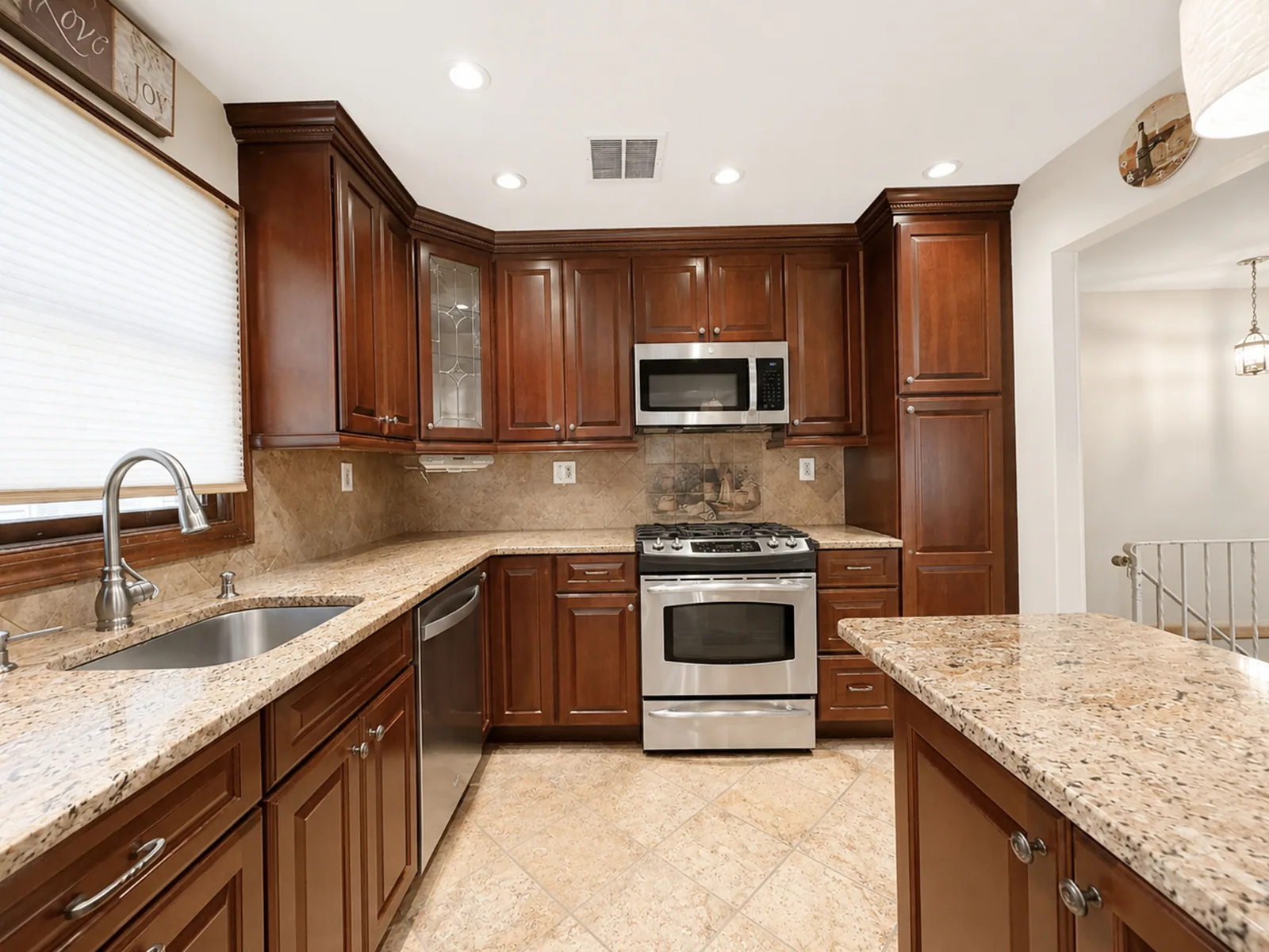 Updated kitchen with granite and stainless at 89 Evergreen Street